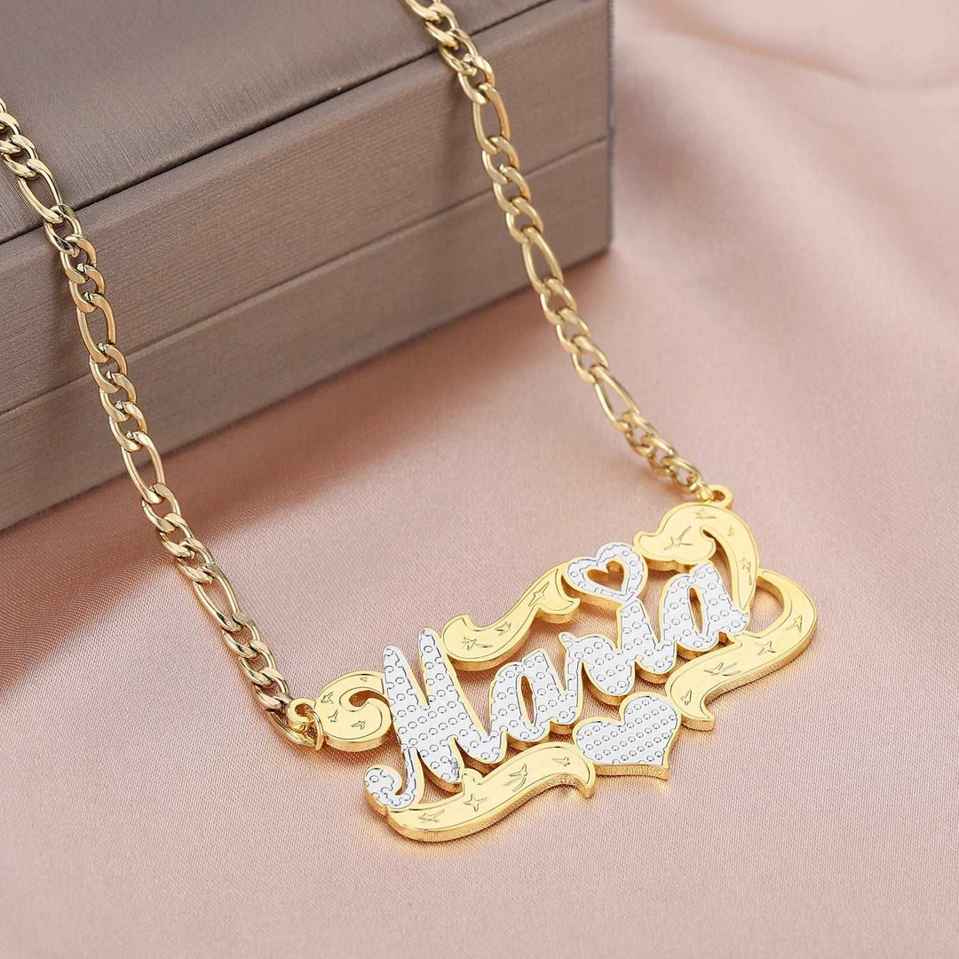 a gold plated necklace with the word love on it