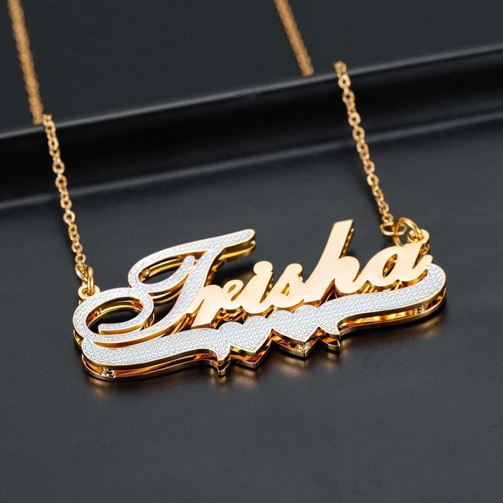 a gold necklace with the word friskka on it