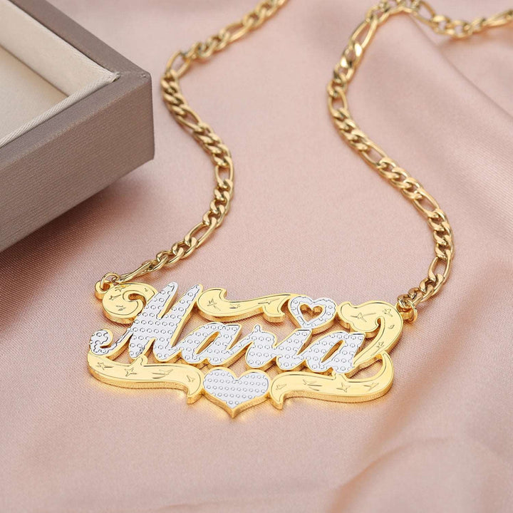 a gold necklace with the word mama on it