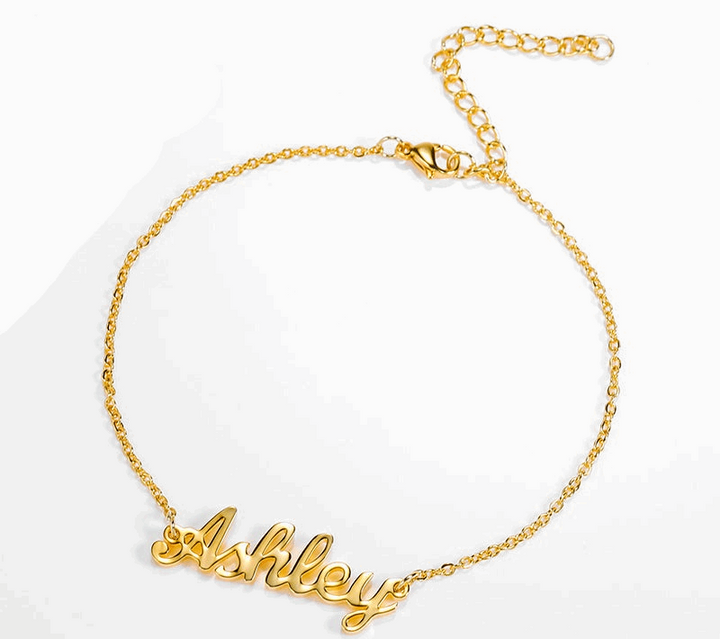 a gold bracelet with the word hello written on it