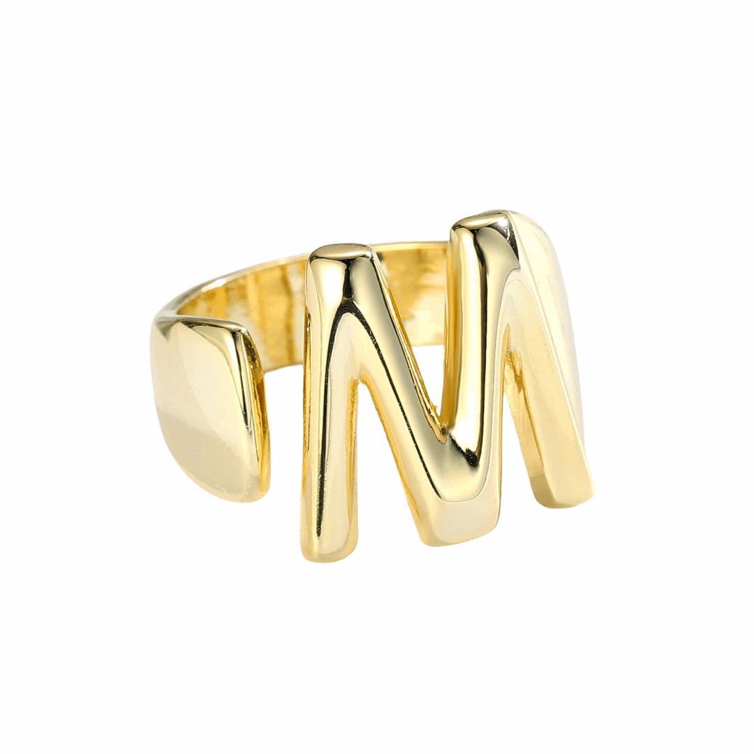 a gold ring with the letter n on it