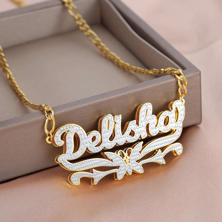 a gold necklace with the word delisho on it