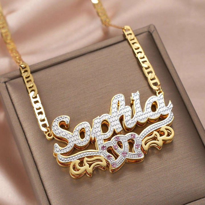 a gold and diamond necklace with the word safara on it