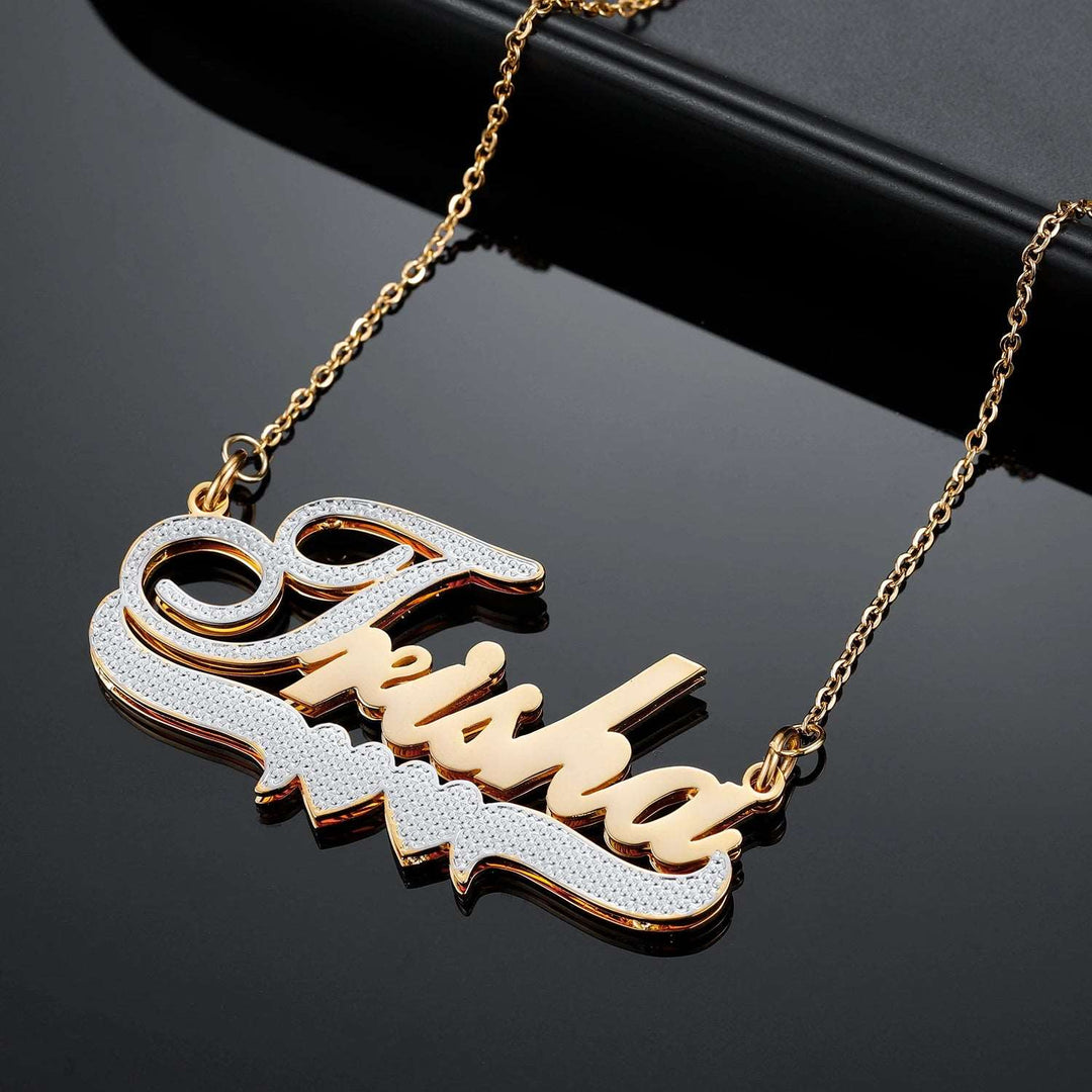 a gold necklace with the word swag on it