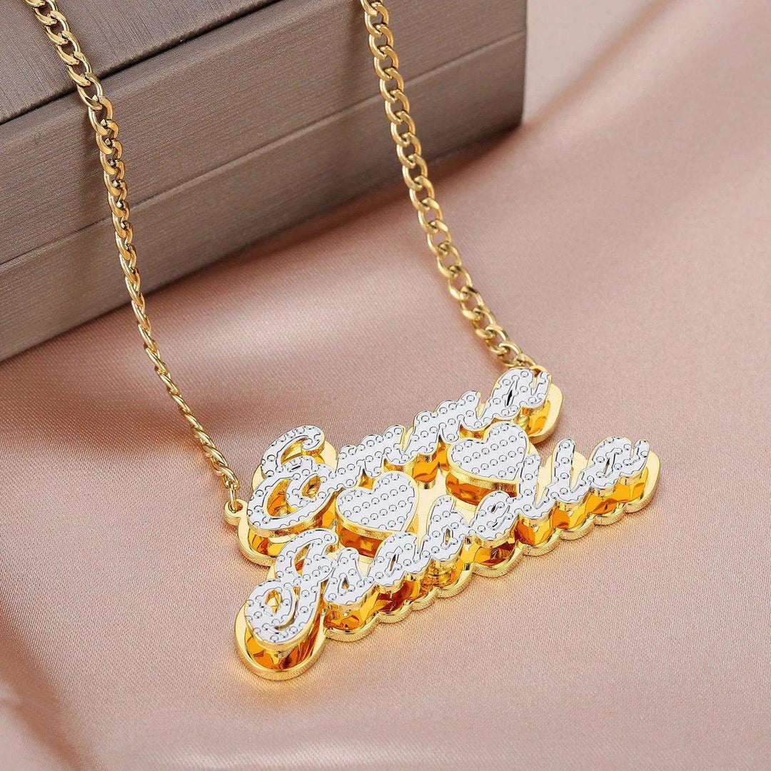 a gold necklace with the word love written on it