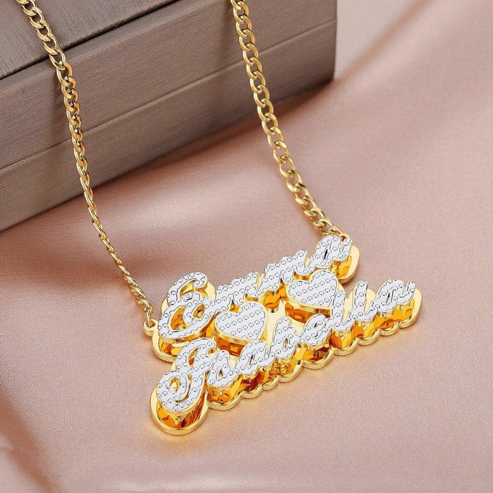 a gold necklace with the word love written on it