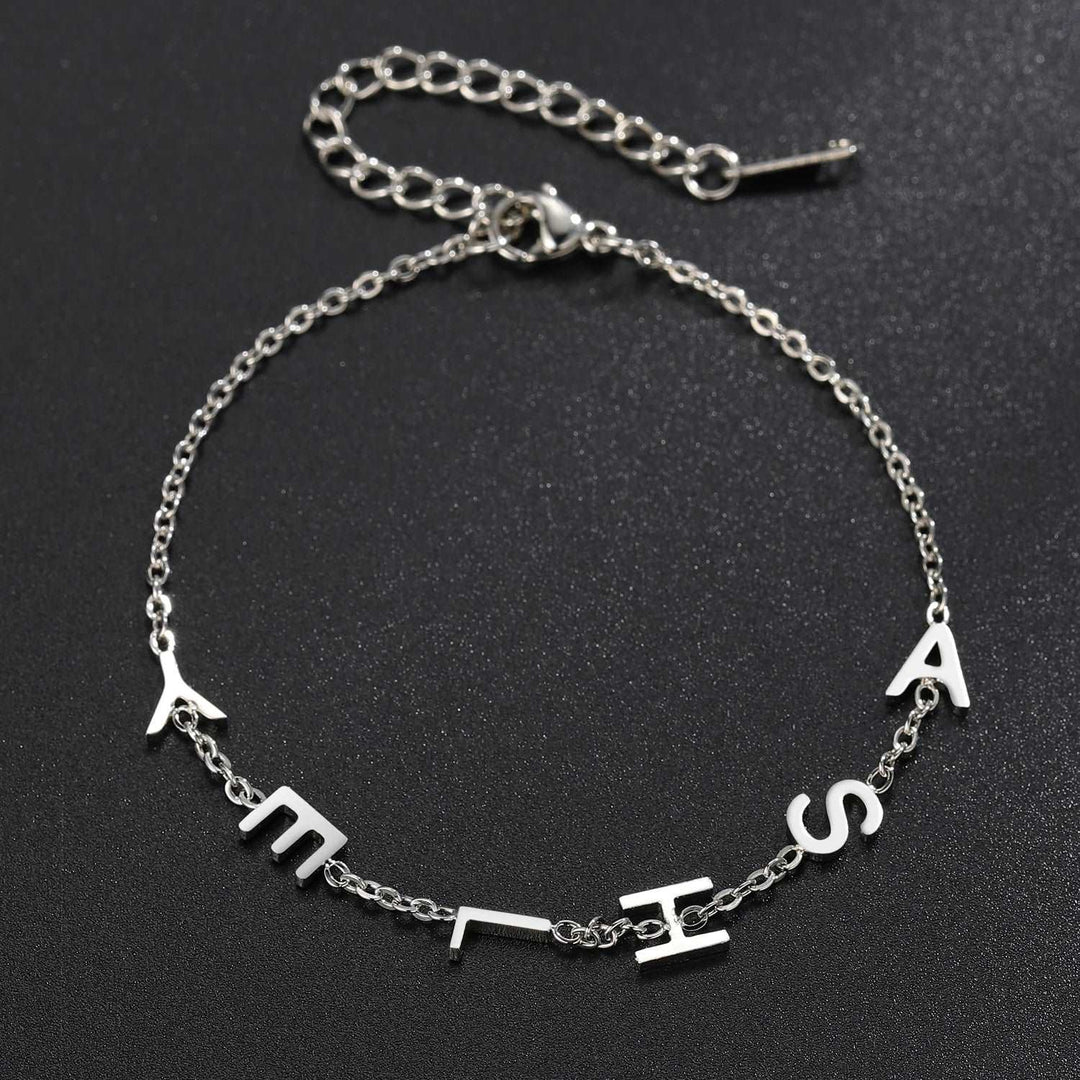 a silver bracelet with the word love on it