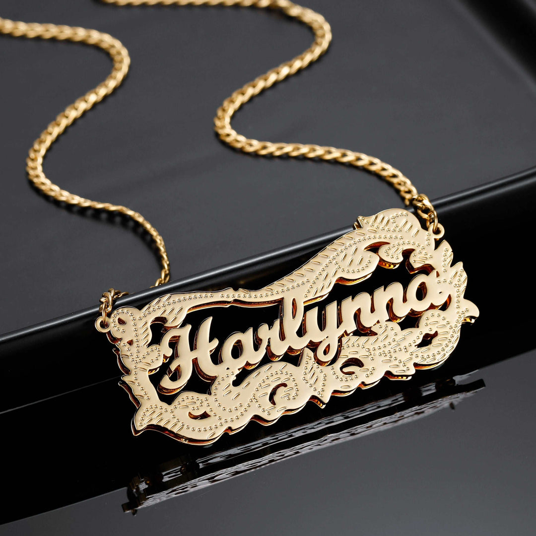 a gold necklace with the word hollywood on it