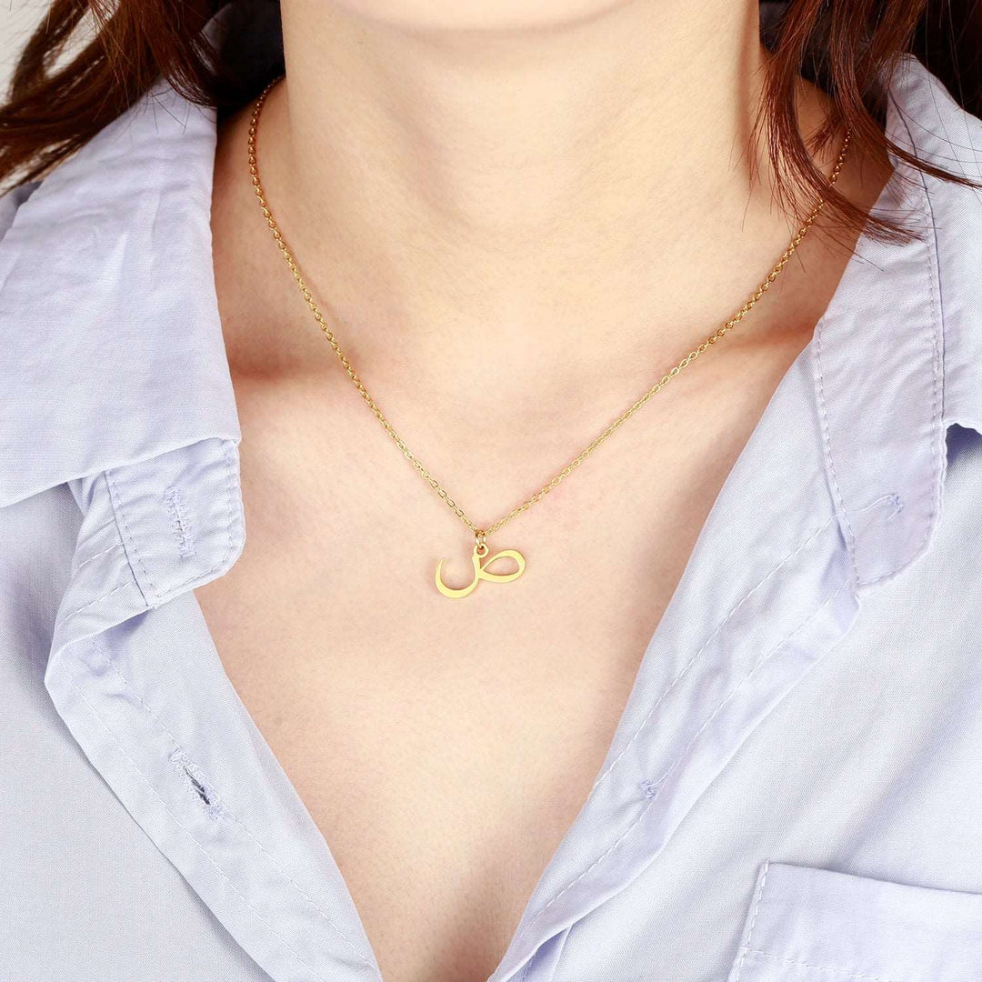 a close up of a person wearing a necklace