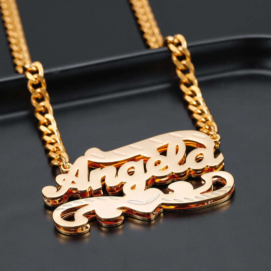 a gold plated necklace with a name on it