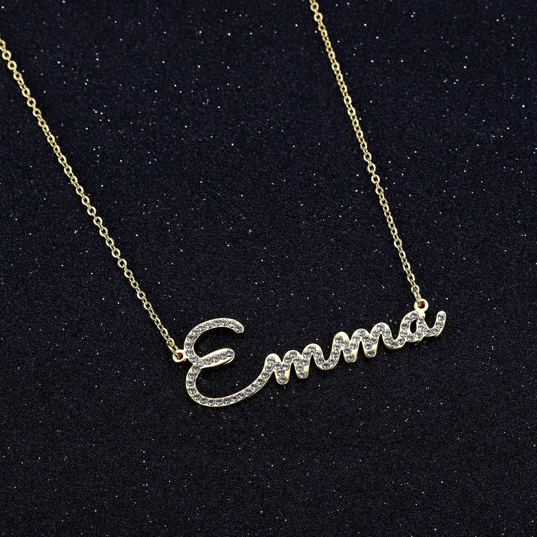 a gold necklace with a name on it