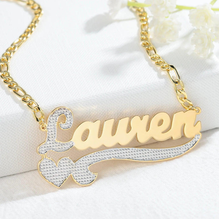 a gold necklace with a name on it