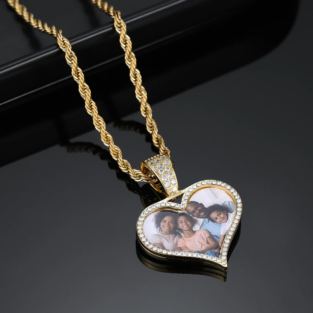 a heart shaped necklace with a picture on it