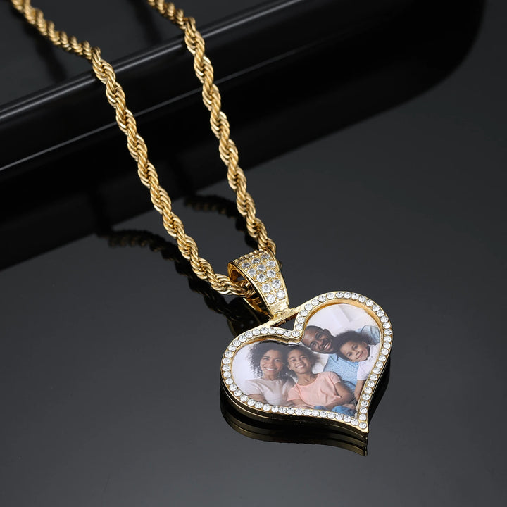 a heart shaped necklace with a picture on it