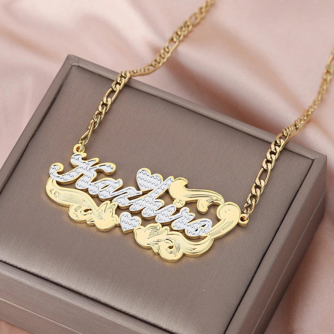 a gold necklace with a name on it