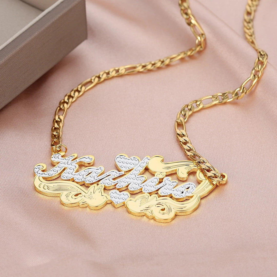 a gold necklace with the word love written on it