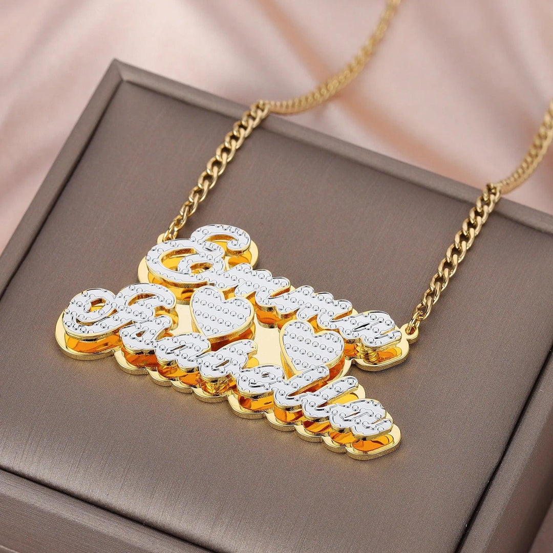 a gold and diamond necklace with the word love on it