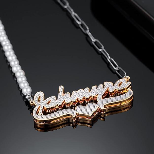 a necklace with a name on it sitting on top of a table