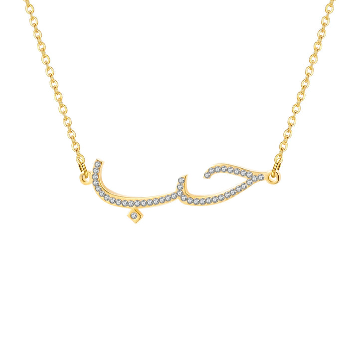 a gold necklace with a diamond letter on it