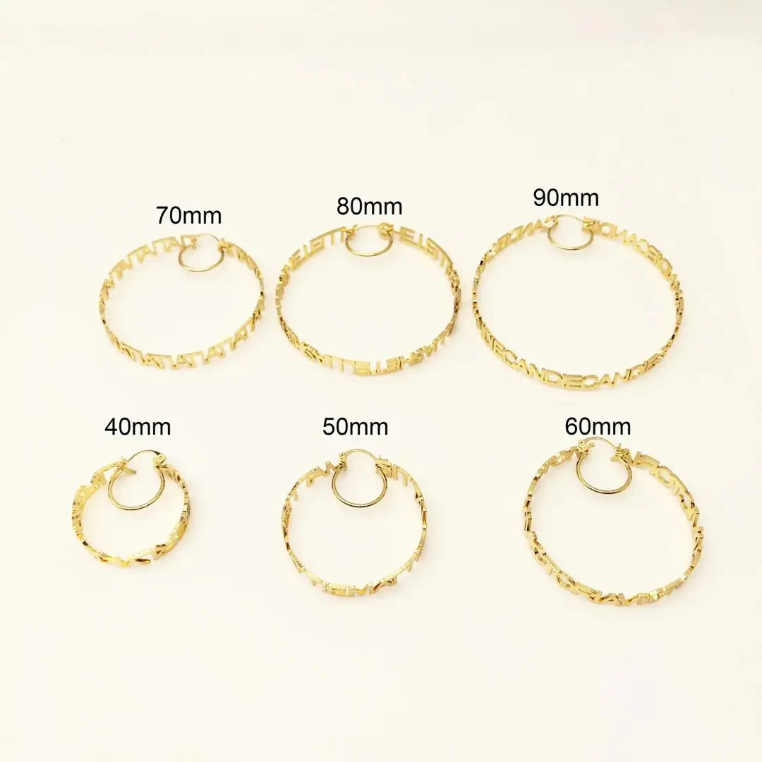 a set of five pairs of gold hoop earrings