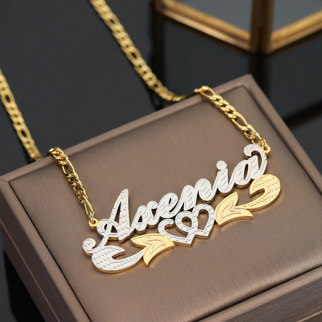 a gold necklace with a name on it